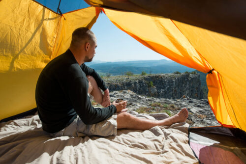 man-with-a-mug-in-an-camping-outdoor-2024-05-13-05-28-19-utc Lightweight Outdoor Camping Tent for 2 People - Orange
